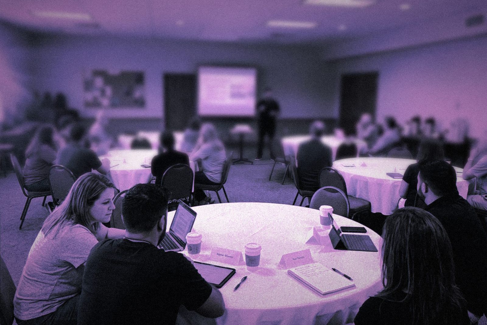 Church staff at round tables during an AI workshop