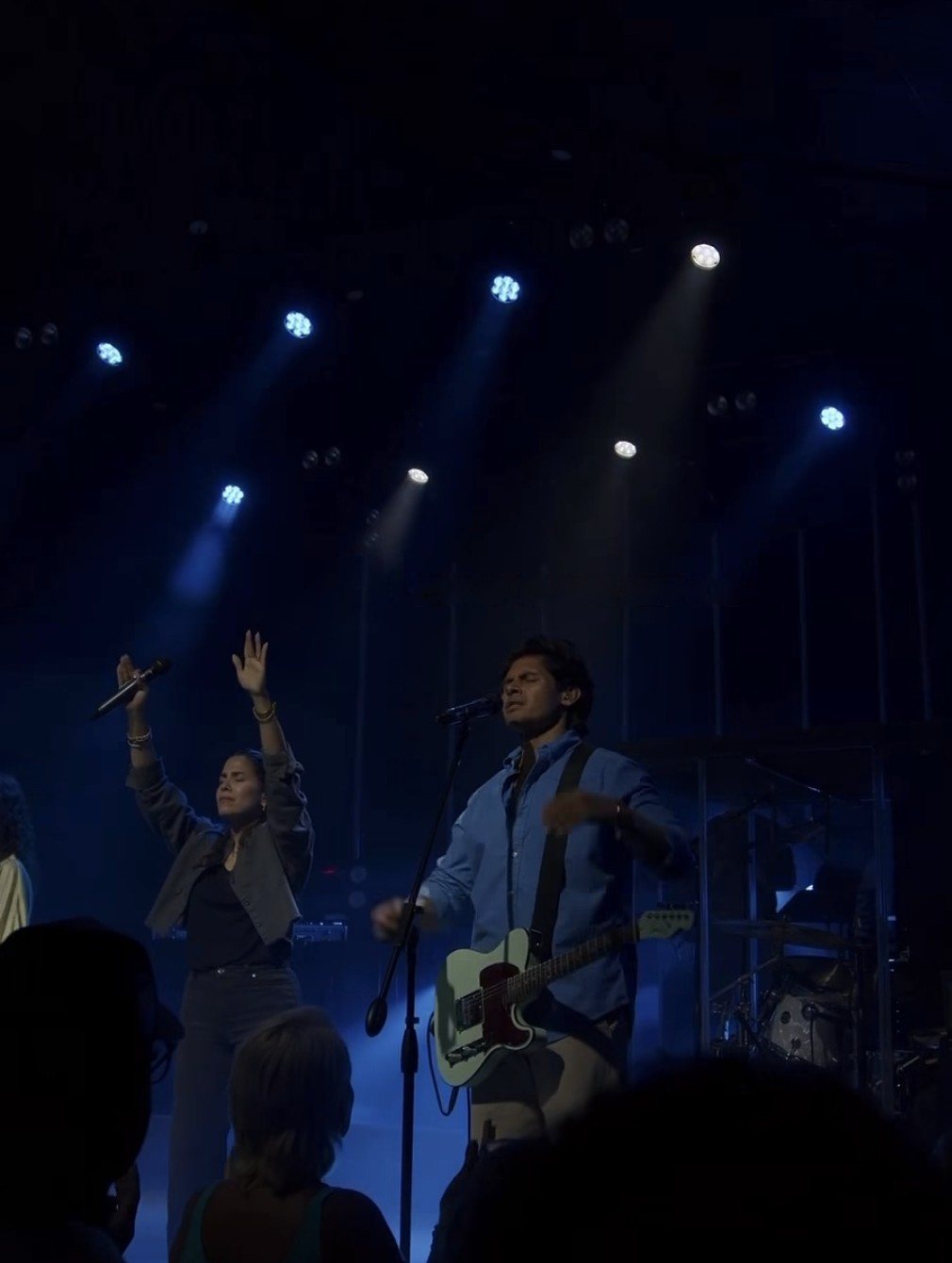 A Sunday worship moment with hands raised at Vision Church