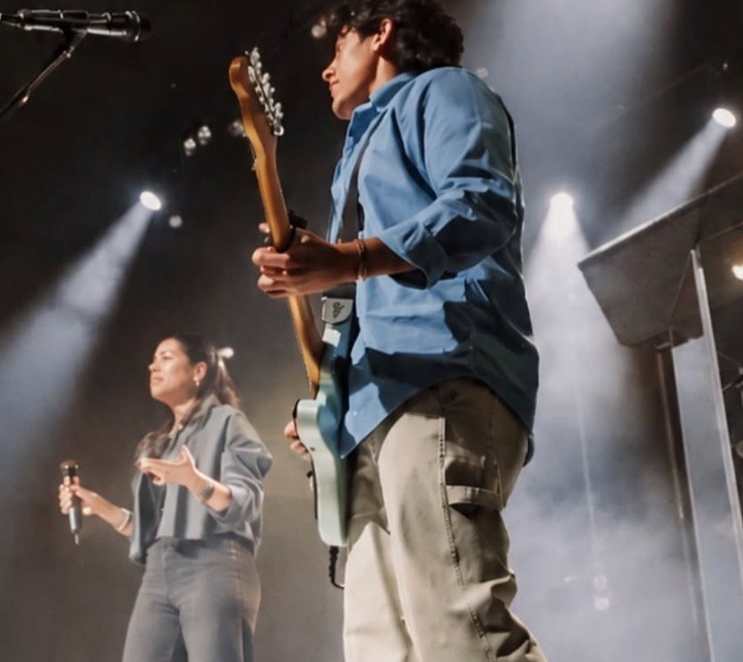 Vision Church worship team leading on stage under stage lights