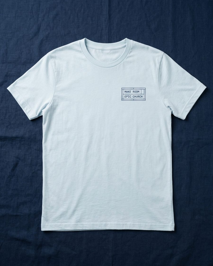Pale blue tee with a small boxed MAKE ROOM pocket mark